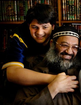 Ayman Omran photographed as a 13-year-old with his father Sheik Mohammed Omran in 2003.