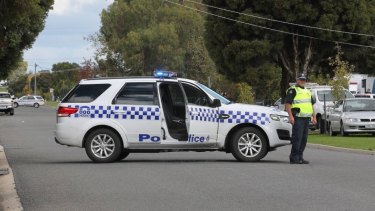 Police block the street in Wangaratta on Tuesday.