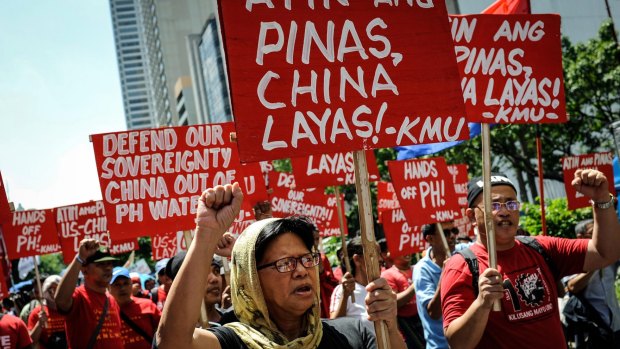 Anti China protesters rally against China's territorial claims in the Spratly islands in the South China Sea in front of the Chinese Consulate in Makati, Philippines in July.