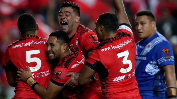 Red hot: Andrew Fifita leads Tongan celebrations against Samoa.