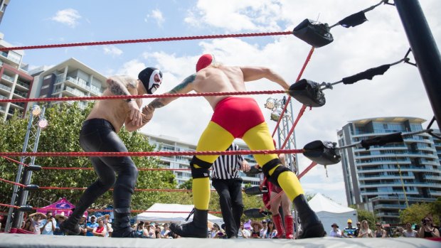 Professional Mexican wrestlers on show.