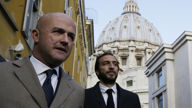 Italian journalists Gianluigi Nuzzi, left, and Emiliano Fittipaldi, have outlined divisions between Cardinal Pell and the Pope.
