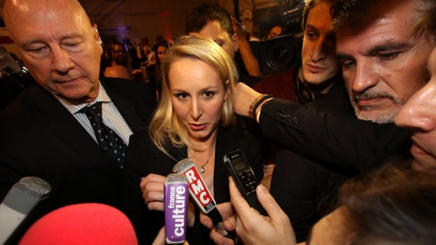 National Front regional leader Marion Marechal-Le Pen speaks to reporters after elections in France.