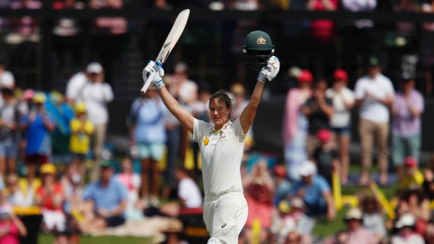 Cracking knock: Ellyse Perry salutes the crowd after reaching triple figures.