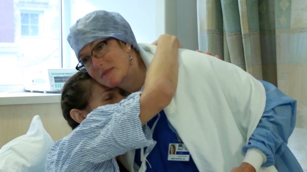 Natalie Turner hugs Dr Marci Bowers before the surgery.