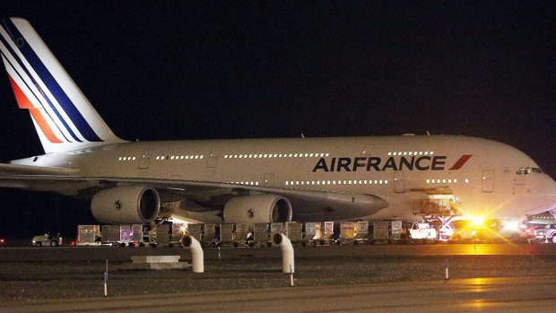 A child was found travelling on a Paris-bound flight without a ticket.