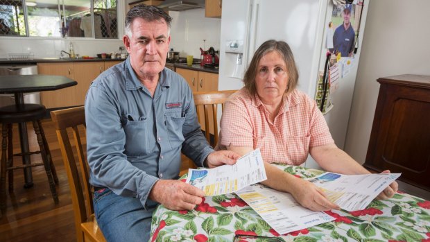 Jenny and Wally Jacobs looking at gas bills from their Melbourne unit. 