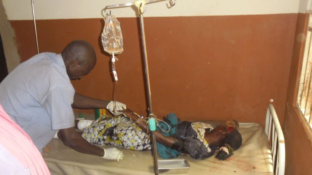 A woman is treated in hospital after being injured during a suicide bomb attack at the Redeemed Christian Church of God in Potiskum, Nigeria on Sunday. Six people were killed.