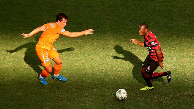 Shadow boxing:  Romeo Castelen of the Wanderers controls the ball in the Brisbane sun.