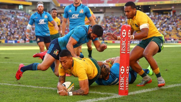 Israel Folau scores a try during the International Test match between the Wallabies and Italy at Suncorp Stadium.