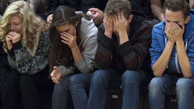 Students attend a vigil at the University of Colorado's Colorado Springs campus for those killed in Friday's shooting at a Planned Parenthood clinic.