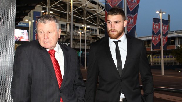 Dragons fullback Josh Dugan, right, arrives at a judiciary hearing on July 29, 2015 for an unrelated matter.