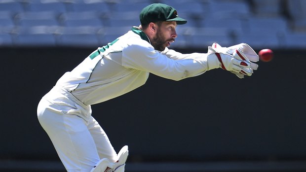 Tasmanian keeper Matthew Wade takes a catch against Victoria.