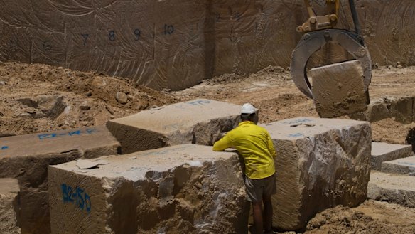 Workers at the Bundanoon Sandstone quarry in Harris Street, Pyrmont. The yellow block sandstone will be used to restore some of the city's most important heritage buildings.