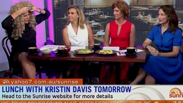Guest Kristin Davis looked on with alarm as Sam Armytage donned a wig on Sunrise.