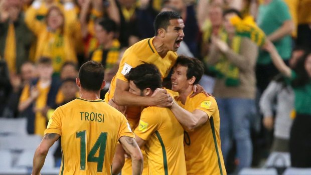 Australia's Tim Cahill, top, scored the winning goal in a dramatic extra time goal.