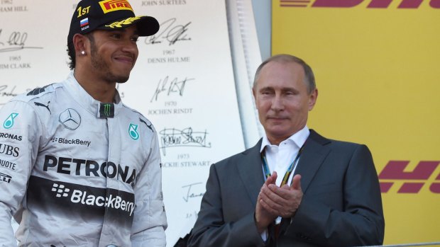 Lewis Hamilton is congratulated by Russian President Vladimir Putin.