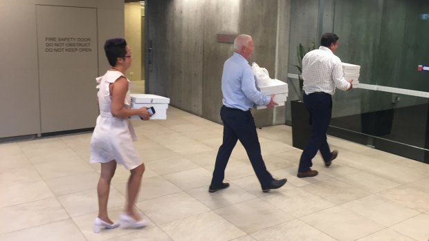 Pizzas arrive during the marathon negotiations on Monday night.
