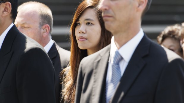 Curtis Cheng's daughter Zilvia attends her father's funeral.