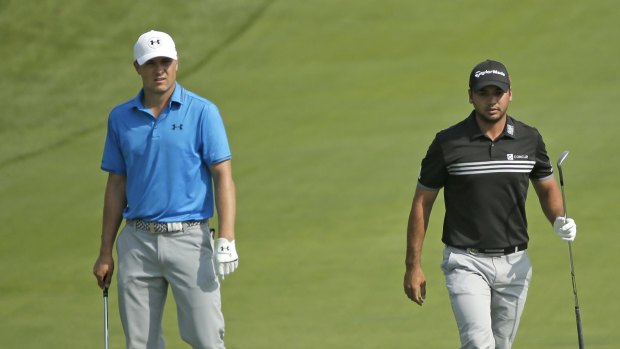 Jordan Spieth, left, and Jason Day, right, won't be going head-to-head.