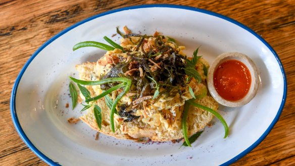 Seaweed scrambled eggs with manchego, crispy shallots and macadamia sriracha.