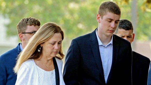 Brock Turner, right, attends court. 