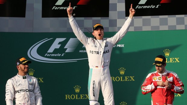 Mercedes driver Nico Rosberg, centre, of Germany, celebrates after winning the Australian Formula One Grand Prix at Albert Park in Melbourne in 2016. 