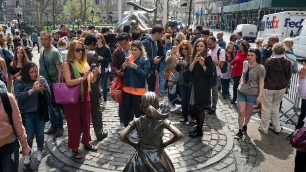The artist behind the "Charging Bull" statue, which faces the "Fearless Girl", says the installation of the girl has changed the meaning of his artwork into something negative.