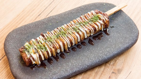 Okonomi-yaki pancake gets the kebab treatment.