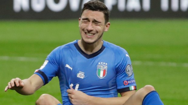 Down and out: Italy's Matteo Darmian.