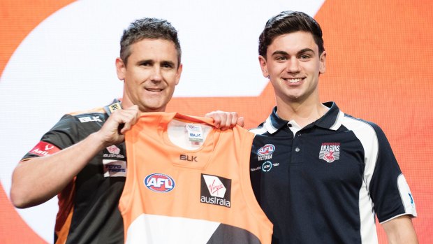 GWS Giants coach Leon Cameron poses with the number two draft pick TIm Taranto.