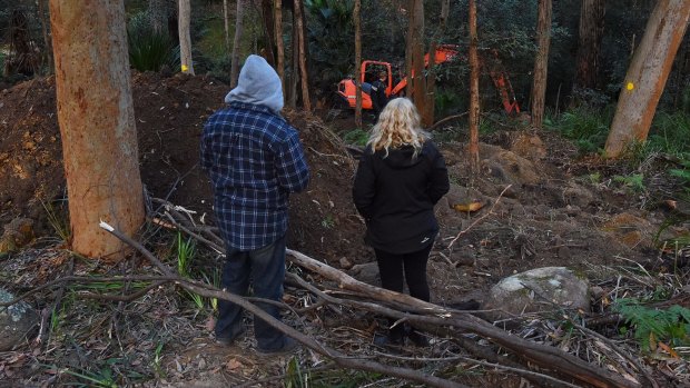 The parents of Matthew Leveson, Mark (left) and Faye (right) at the site in the Royal National Park at Waterfall.