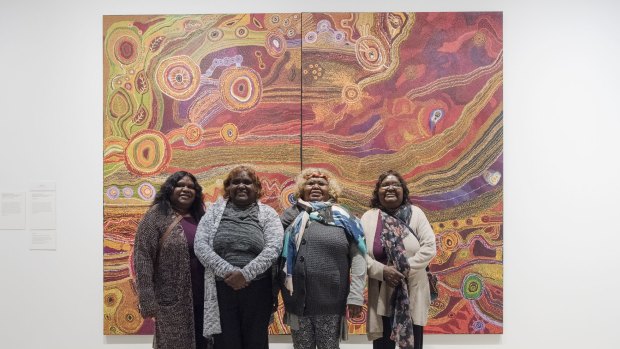 The Ken family in front of their Wynne Prize-winning work, Seven Sisters. 