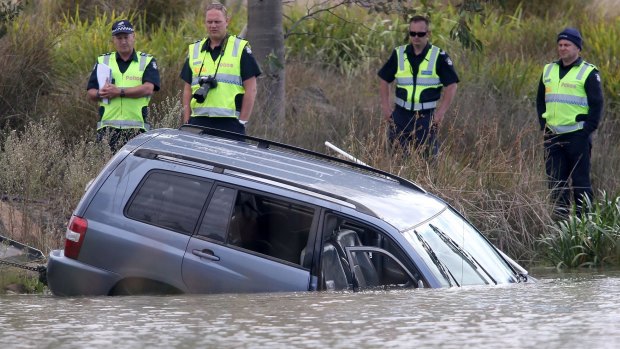 Akon Guode's car is pulled from the lake where three of her children died in April 2015.