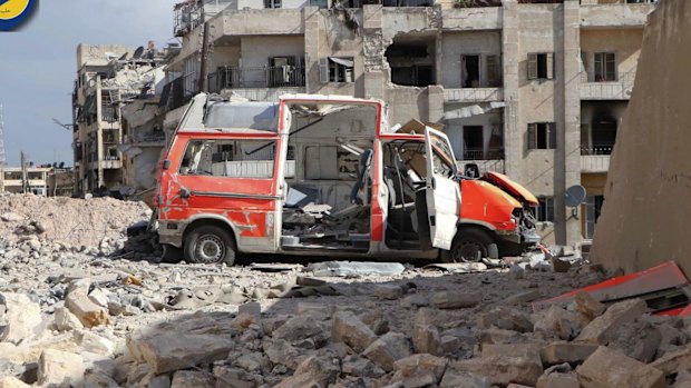 A destroyed ambulance is seen outside the Syrian Civil Defense main centre after airstrikes in eastern Aleppo. 