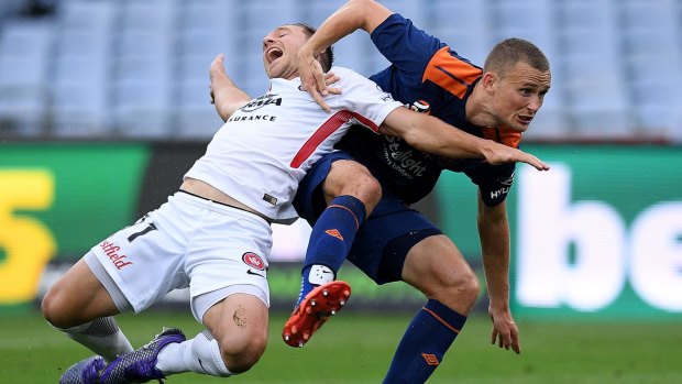 Acrobatic: Brendon Santalab of the Wanderers is tackled by Daniel Bowles.
