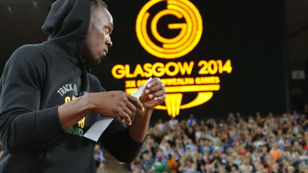 A hit: Usain Bolt prepares for the relay heats.