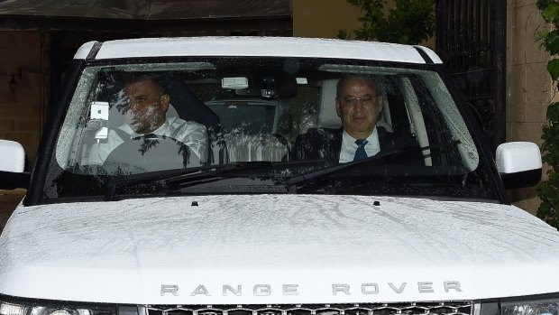 Eddie Obeid (right) leaves his home in Huntrs Hil this morning. 