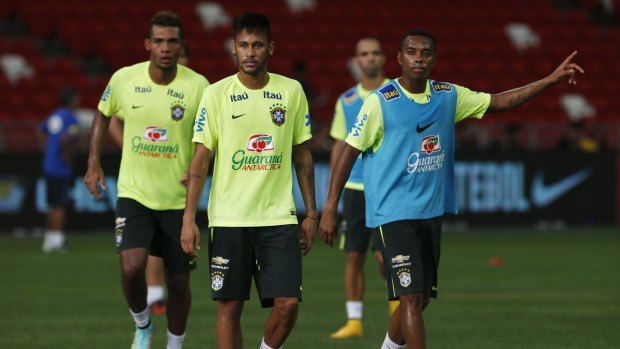 New rules: Brazilian players Neymar (second left) and Robinho (right) at a training session earlier this month.