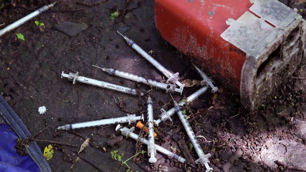 Used hypodermic needles without protective sheaths at an encampment where opioid addicts shoot up along the Merrimack River in Lowell, Massachusetts. 