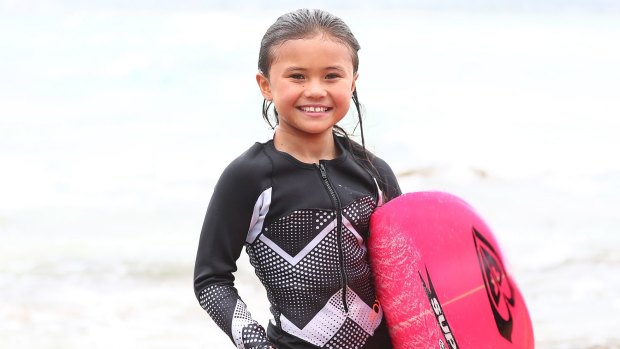 Sky Brown, eight years old from Japan, poses at Snapper Rocks.