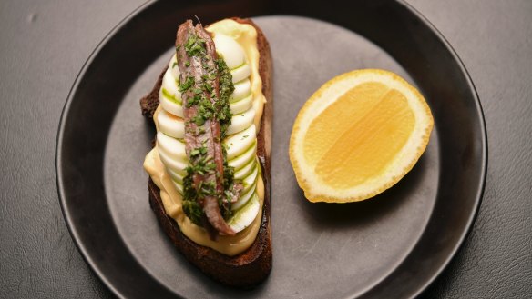 Toast with the most: Anchovy toast loaded with with egg sliced, salsa verde and mayonnaise.