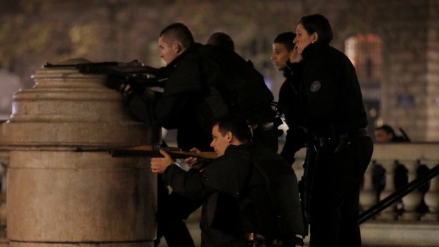 Police react to suspicious behaviour at Place de la Republique in Paris on Sunday.