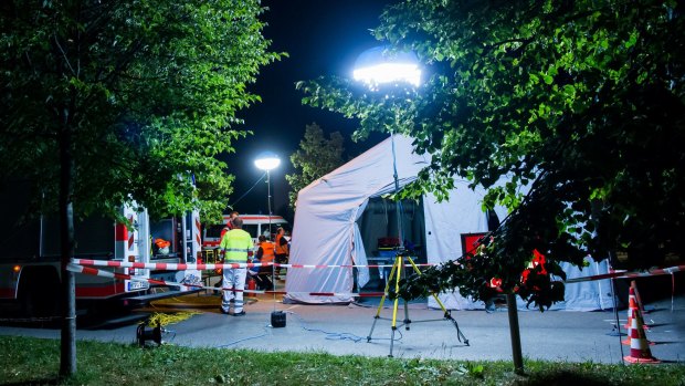 A mobile care and help centre is erected in a parking area near the Olympia Einkaufzentrum after the shooting.