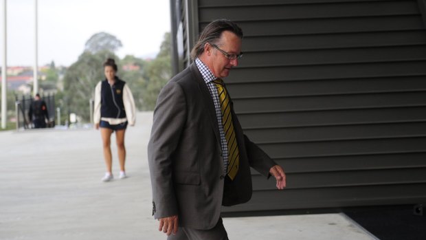 Easts president Greg Dennis arrives at Wednesday's meeting of the clubs and Michael Jones.