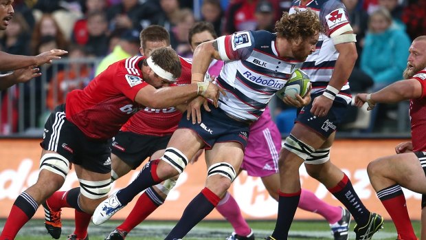 No easy matches: Scott Higginbotham of the Rebels on the burst against the Crusaders.