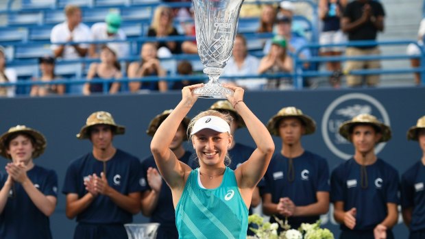 On top: Daria Gavrilova holds the trophy after her victory over Dominika Cibulkovain the Connecticut Open final. 