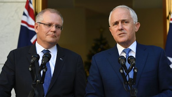 Scott Morrison and Malcolm Turnbull announce the royal commission, a sharp U-turn from their previous refusal to consider it.