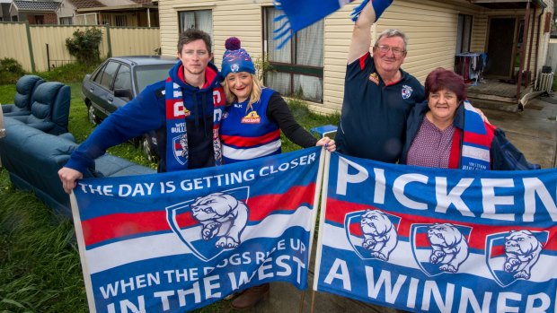 The Moore family pictured on grand final day outside their Braybrook home. From left: Chris Patmore and Nicole Moore, and Geoff and Irene Moore. 
