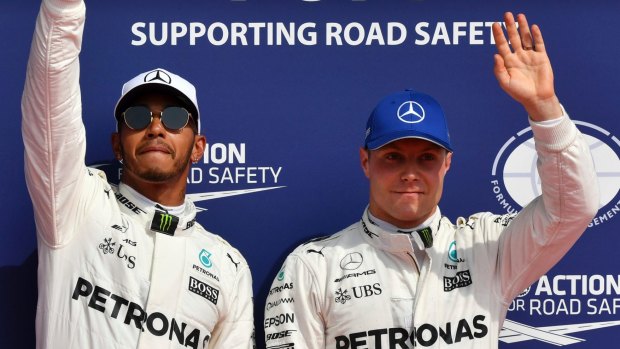 Mercedes' Lewis Hamilton, left, on the podium with Valtteri Bottas.
